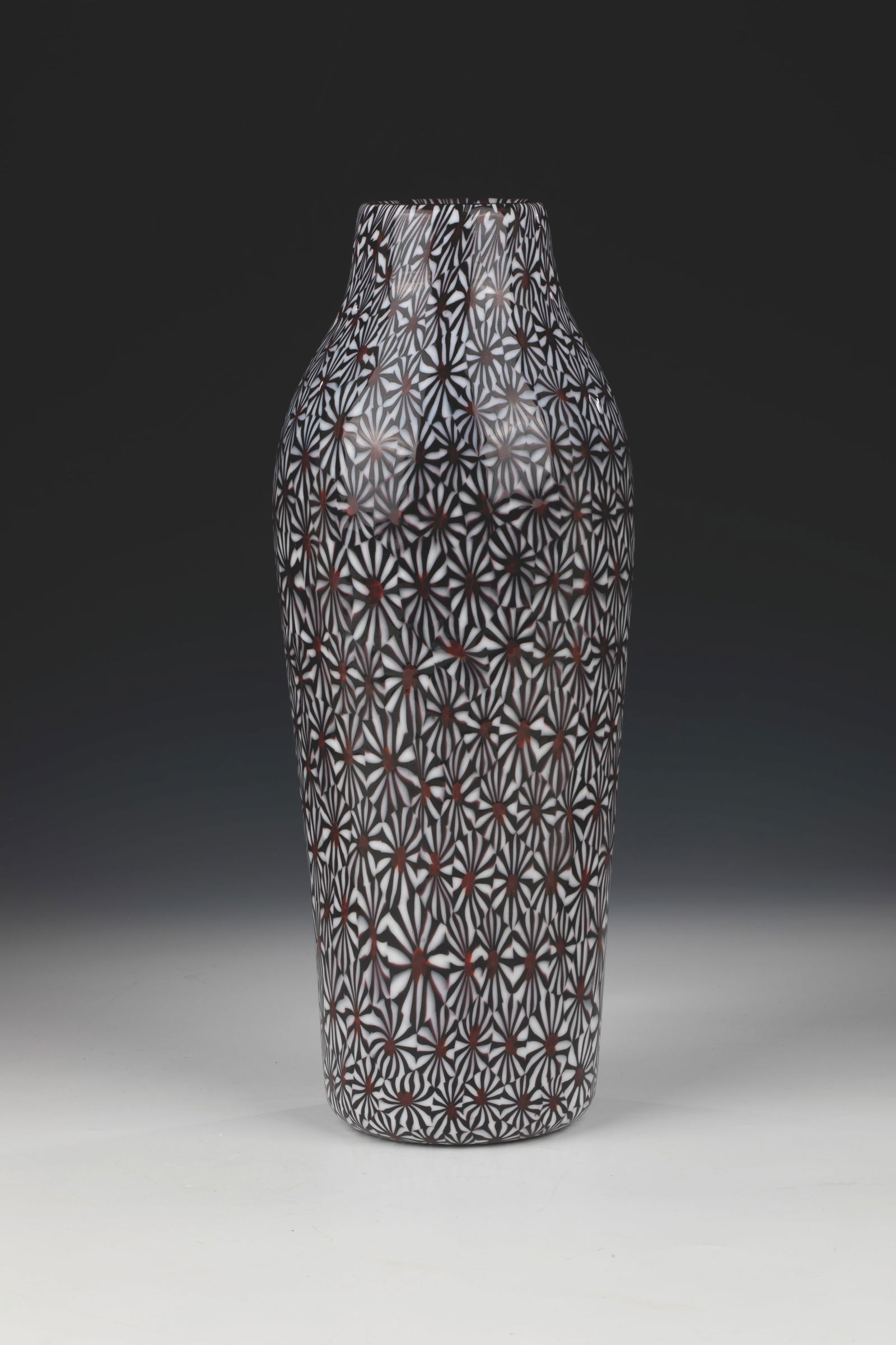 Vase ''Kiku'': Vase ''Kiku'' Ermanno Toso (Design), Fratelli Toso, Murano, 1950-55 Colourless glass with melted Murrine Kiku in black-violet, white and red. Surface acid-polished. H. 31.5 cm.
