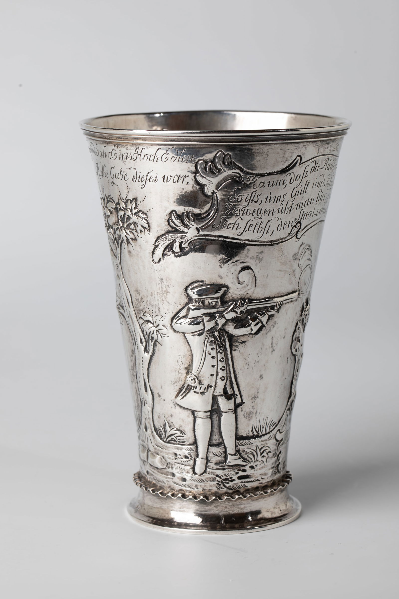 Shooting cup: Shooting cup Wohl Danzig, c. 1669 silver, embossed, ciserlated and engraved. Slightly flared foot with wavy band in relief. Slightly conical cup with flared, profiled lip rim. Below the lip edge dated