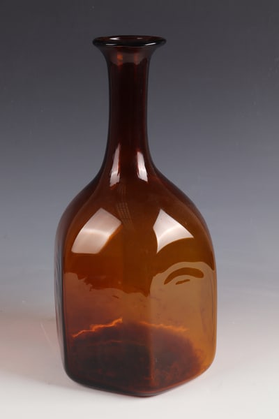 Large Hexagon Bottle: Large hexagonal bottle North Hesse, Ziegenhagen glassworks, 18th century Amber-coloured glass with tear-off. Hexagonal wall in cross-section. Tubular neck with protruding muzzle edge. H. 38 cm