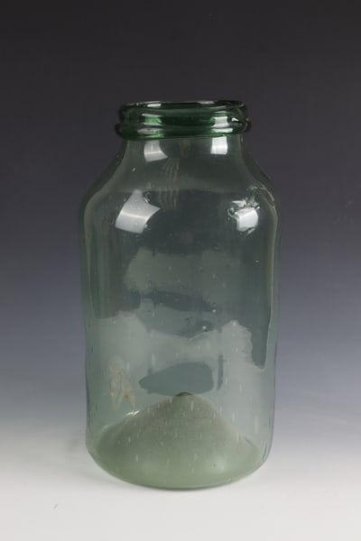 Large Storage Jar: Large storage vessel France, probably Alsace, E. 18th century Light green, bubbled glass. Raised floor with demolition. Muzzle rim with applied glass band. H. 46 cm