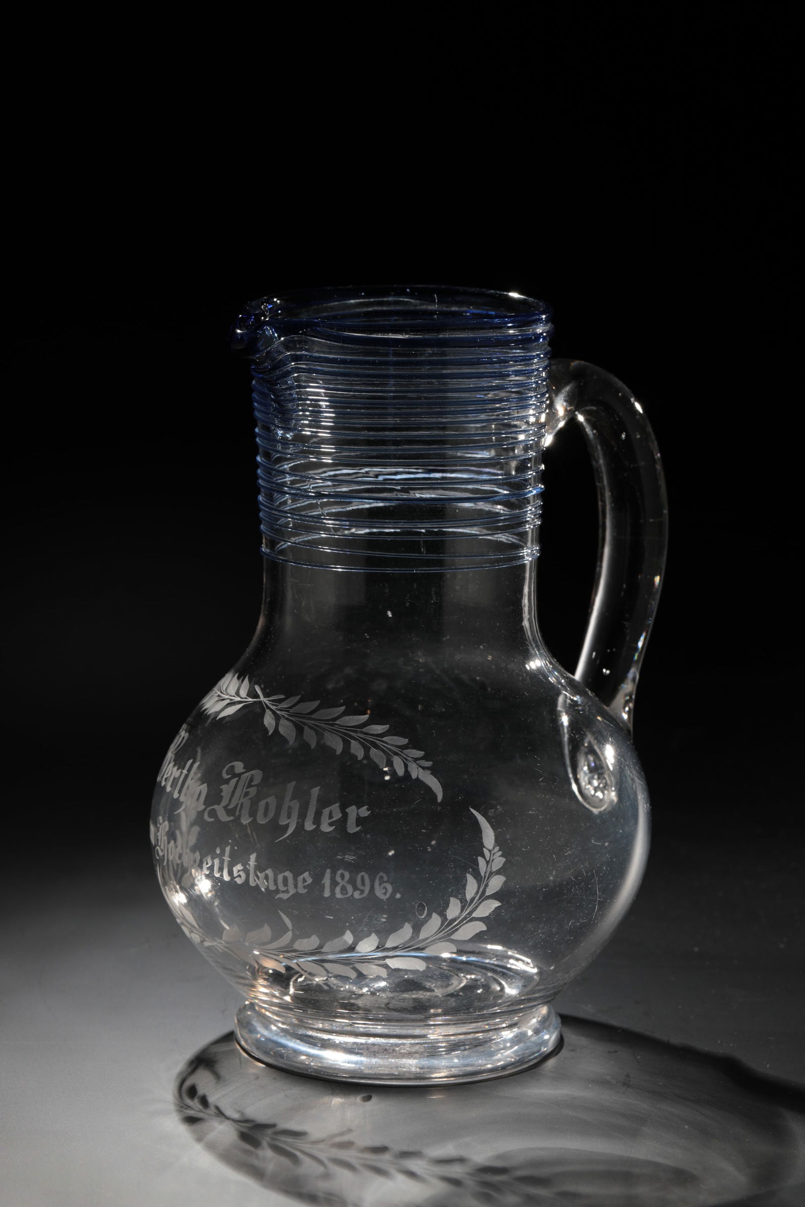 Wedding jug: Wedding jug German, dated 1896 Colourless glass with tear-off. Engraving on the bulbous wall: ''Bertha Köhler on her wedding anniversary 1896''. On the neck and spout spiral thread made of cobalt