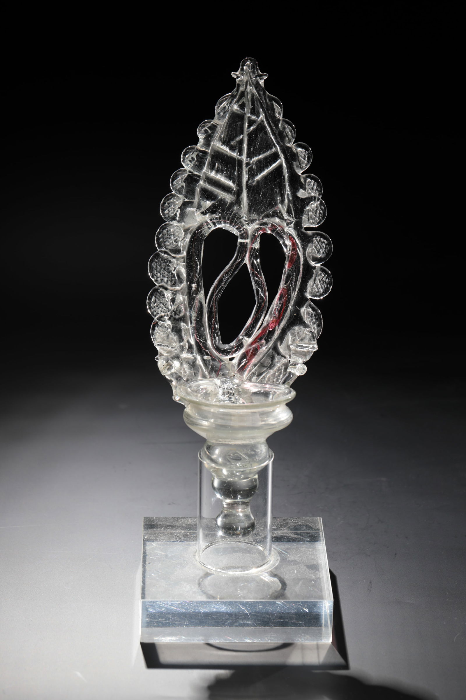 Holy water vessel: Holy water vessel Bayerwald, 19th century Colourless glass. Massive stand with pipe tee. Bell-shaped cymbal with drawn and pinched appliqués and glass bow with incorporated gold ruby thread. H. 25 cm