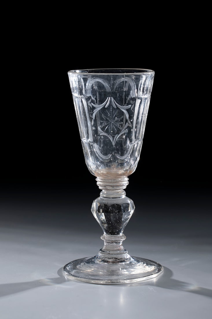 Cup: Goblet Middle German, 2nd half of the 18th century Colourless glass with tear-off. Disc base, faceted baluster shaft, three disc nodi, conically widened cuppa with notched star and olive-cut decoratio