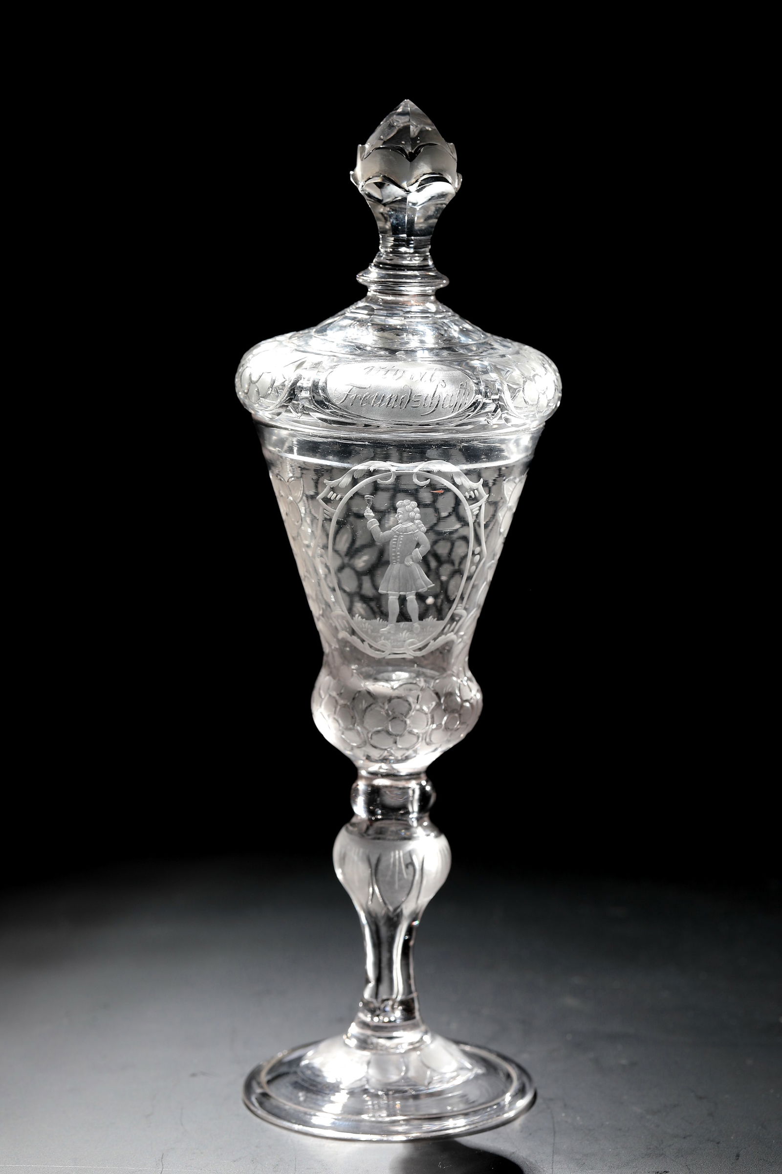 Friendship Cup: Friendship Cup Middle German, 1st half of the 18th century Colourless glass with tear-off. On the slightly ascending disc base with the rim turned down and hollow baluster shaft, cut and matt