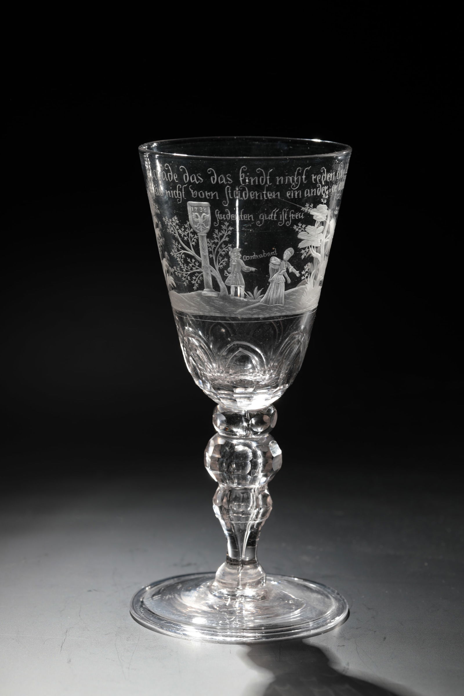 Erotika Cup: Erotika Goblet Middle German, dated 1738 Colourless glass with tear-off. Disc base with the edge folded downwards. Double constricted hollow baluster shaft faceted. Attachment of the conically
