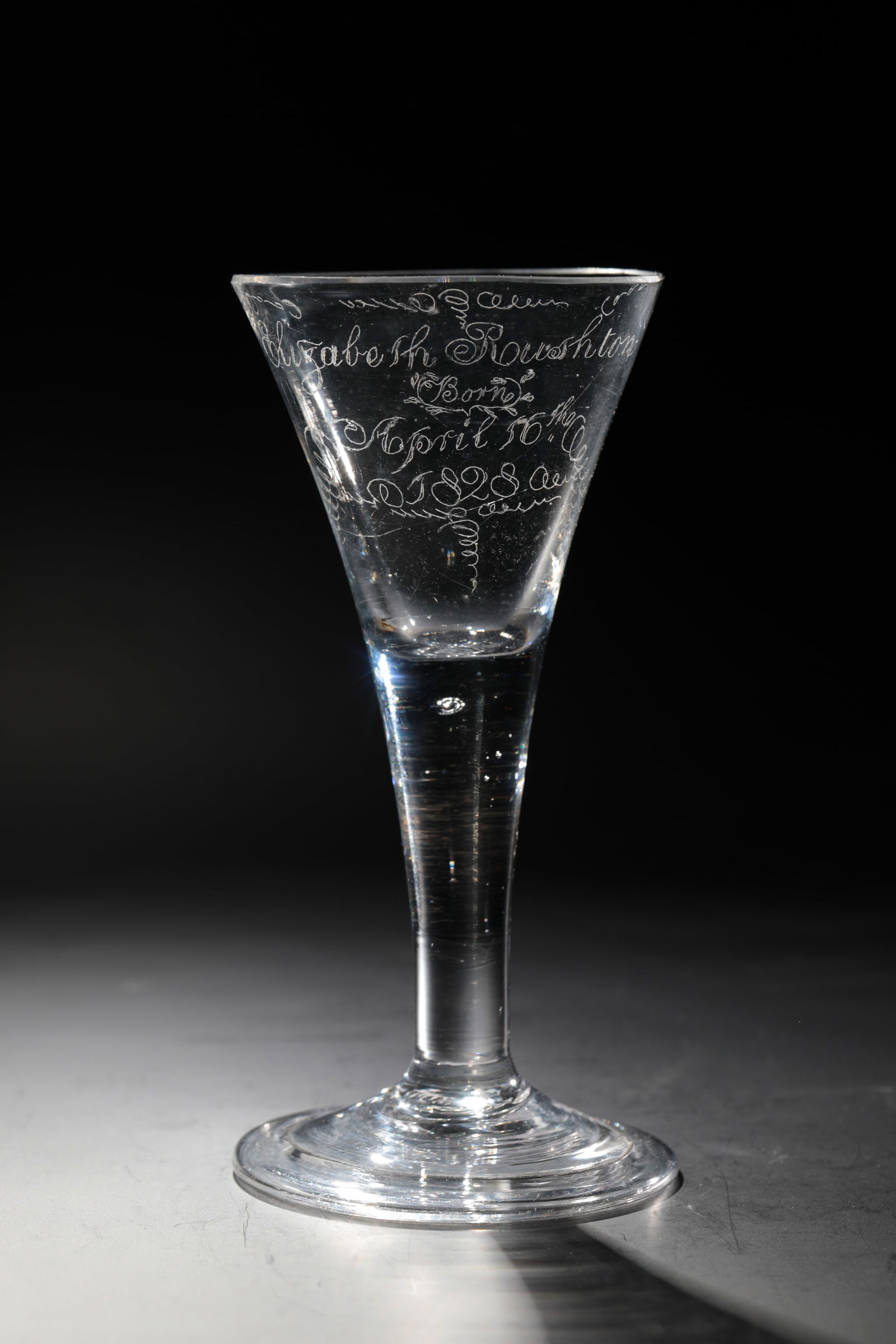 Goblet: Pointed chalice England or Netherlands, 18th century Colourless glass with tear-off. Disc base with the edge folded downwards. Solid shaft with pierced air bubbles. Trumpet-shaped cuppa. Kuppa with la