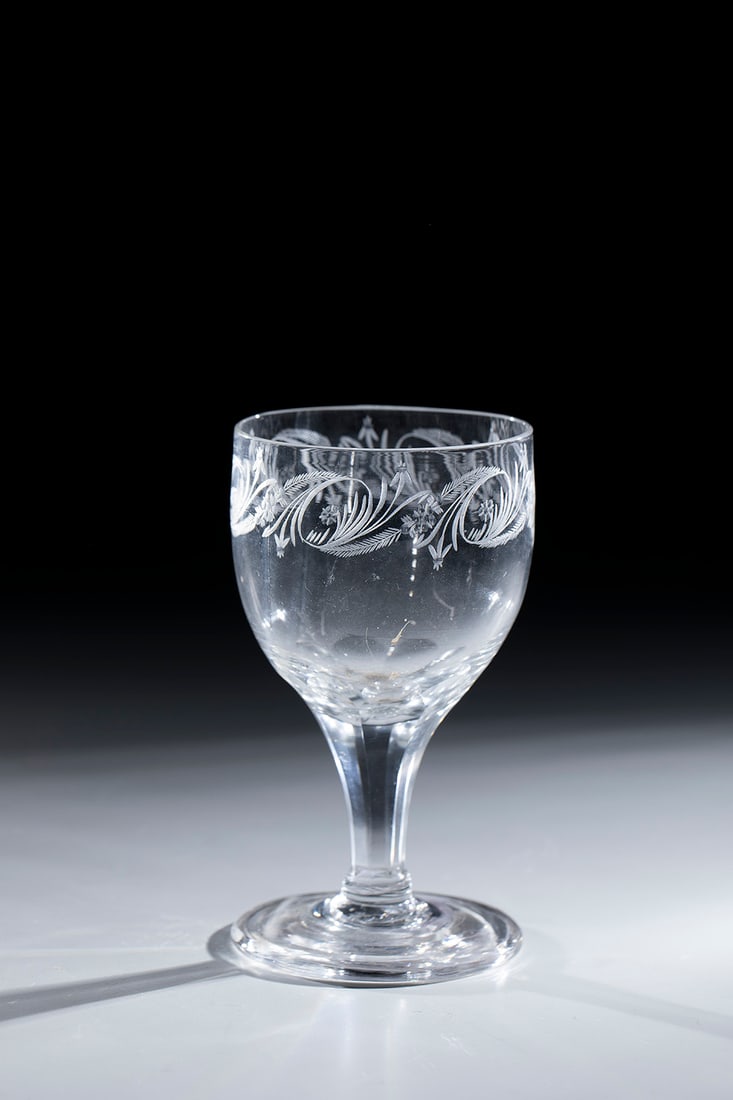 Sweet wine glass: Sweet wine glass North German, 19th century. Faceted shaft. Bulbous body with all-round floral decoration below the lip rim. H. 12 cm