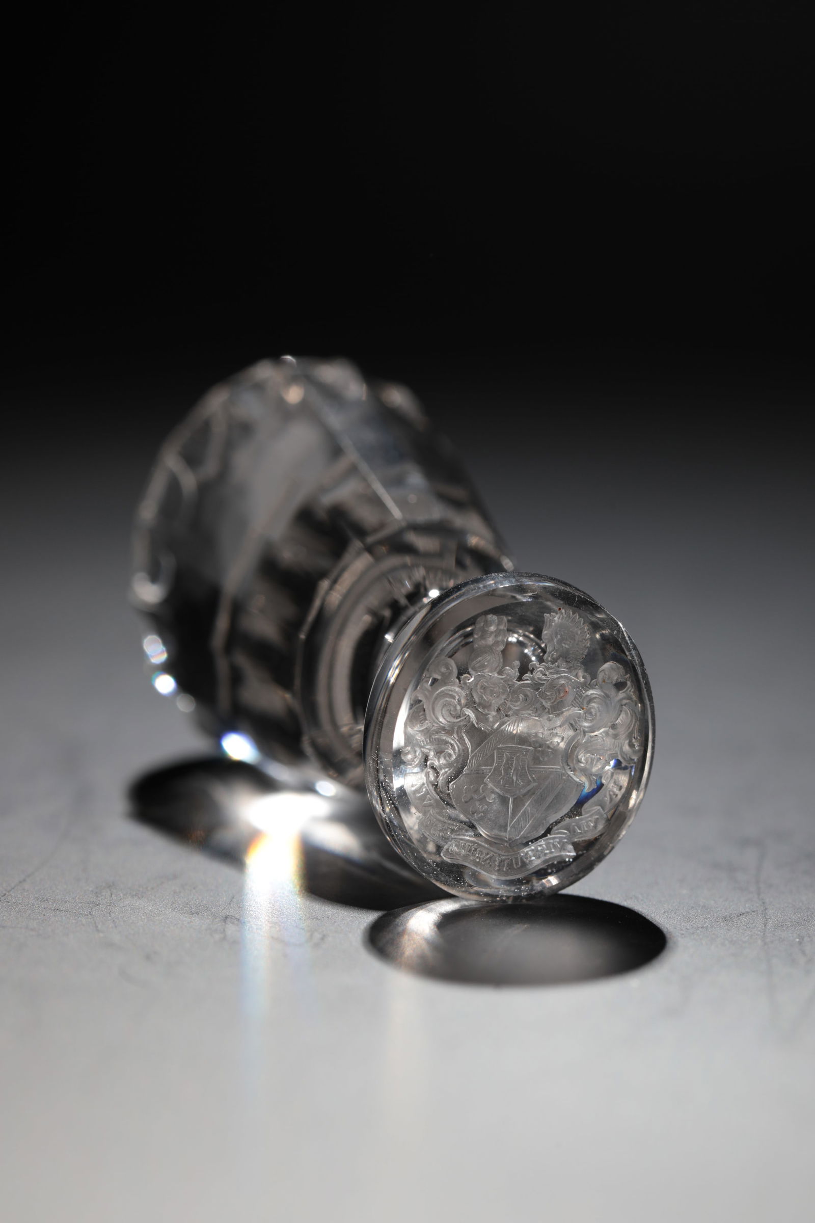 Seal: Seal 19th century Colourless glass. Seal plate with finely engraved coat of arms and banner: ''IN VIA VIRTUTI NULLA EST VIA''. (''On the path of virtue there is no way.'') Multi-faceted handle. L. 6.5
