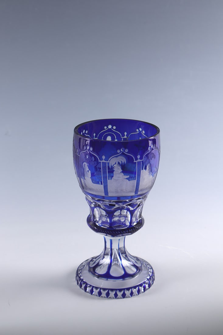 Cup with the Lord's Prayer: Goblet with the Lord's Prayer of Bohemia, c. 1840 Colourless glass with cobalt blue overlay. On the bell-shaped cuppa, the petitions of the Lord's Prayer and a frontal representation of God the Father