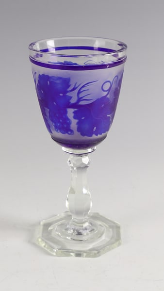 Goblet with vine leaf décor: Goblet with vine leaf decoration Bohemia, c. 1860 Colourless glass. Octagonal foot, faceted baluster shaft. The egg-shaped cuppa with ornamentally cut overlay in cobalt blue: vine leaf decoration in