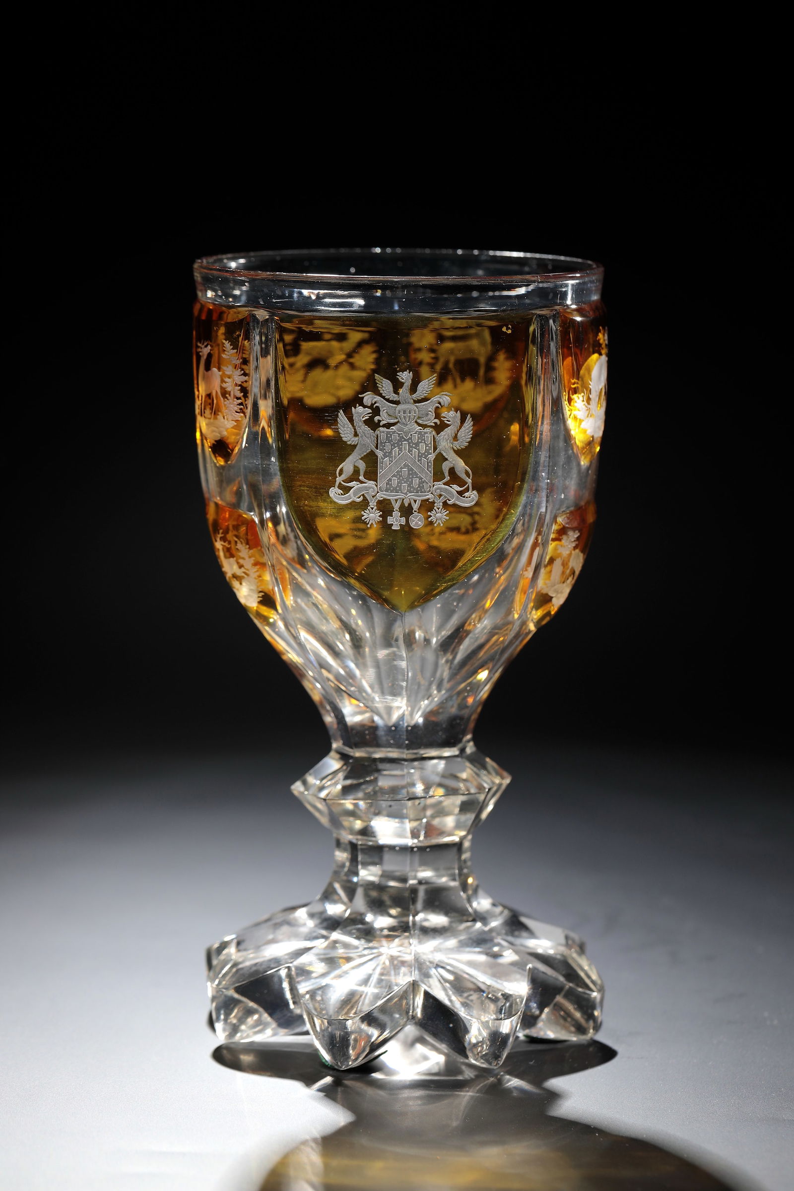 Coat of arms cup with deer: Coat of arms cup with deer Bohemia, mid-19th century Colourless, cut-decorated, partially silver-yellow stained glass with fine deep cut. Eight-pass foot with roller cut decoration. Shaft peeled with