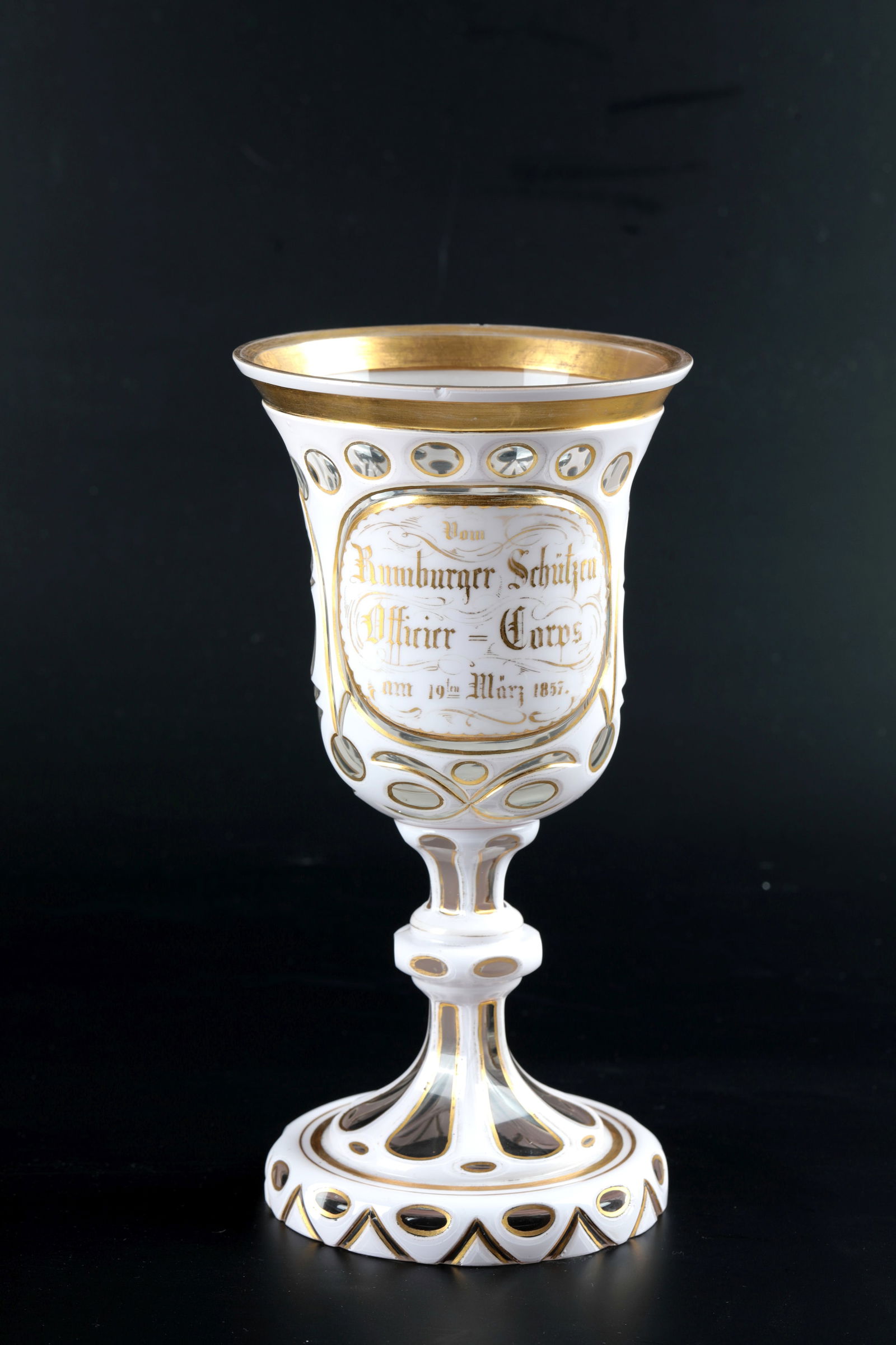 Shooting Cup: Schützen-Pokal Neuwelt, dated 19 March 1857 Colourless glass with dusty pink shimmering tin enamel overlay. Rich cut decoration with gilded edges. Medallion cut high on the bell-shaped cuppa with ins
