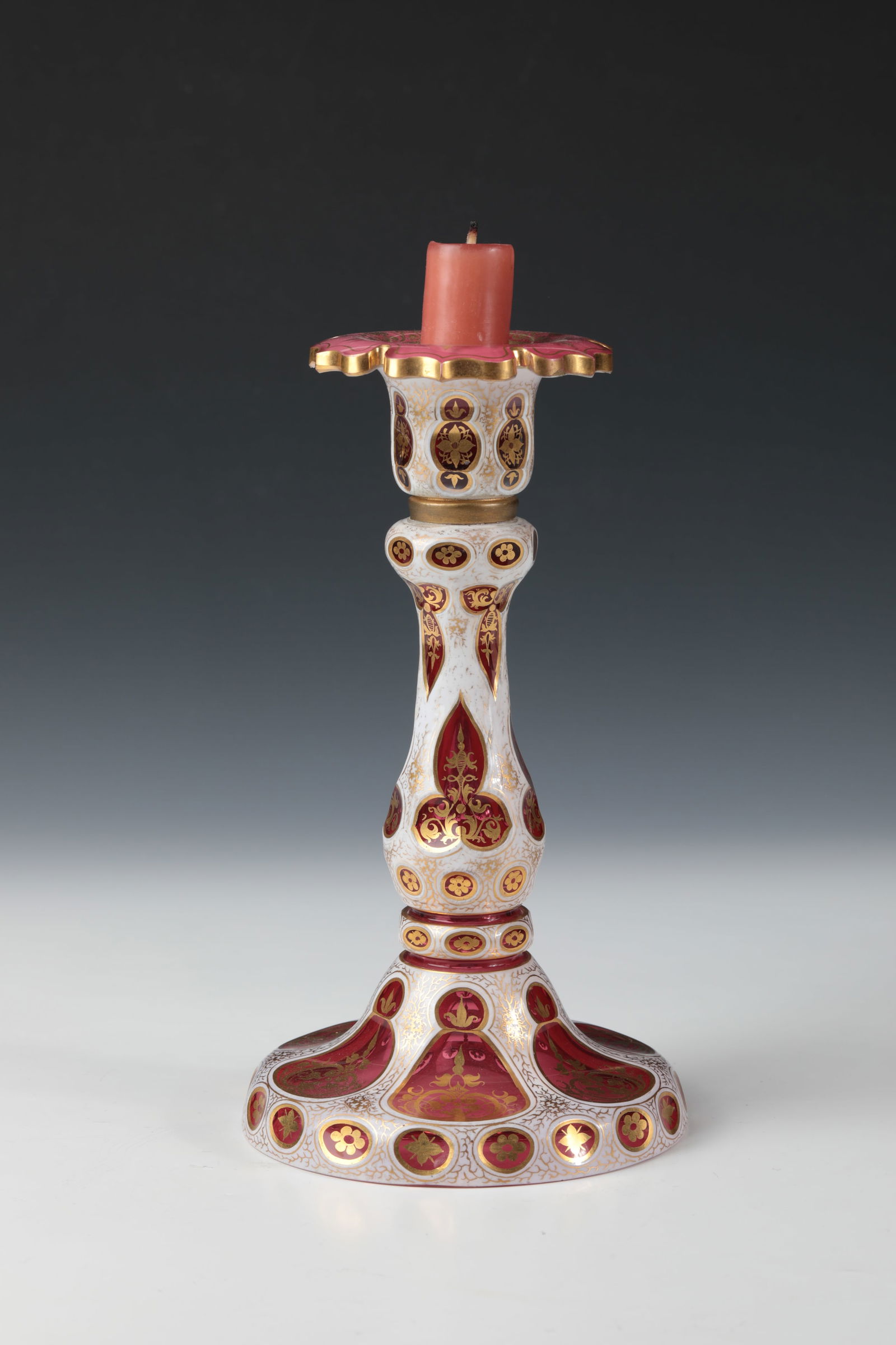 Candlesticks: Candlestick Gräflich Harrach'sche Glasfabrik, Neuwelt, c. 1840 Colourless glass with gold ruby underlay and with ornamentally cut pewter enamel overlay decorated with ornamental gold decoration. H.