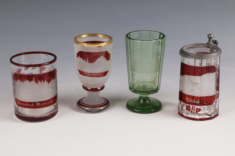 Four View Glasses: Four viewing glasses Bohemia, mid-19th century Colourless, partly red glazed and faceted glass as well as iced surface and green glazed glass. Views cropped on it include: ''Warmbad Wolkenstein'', ''S