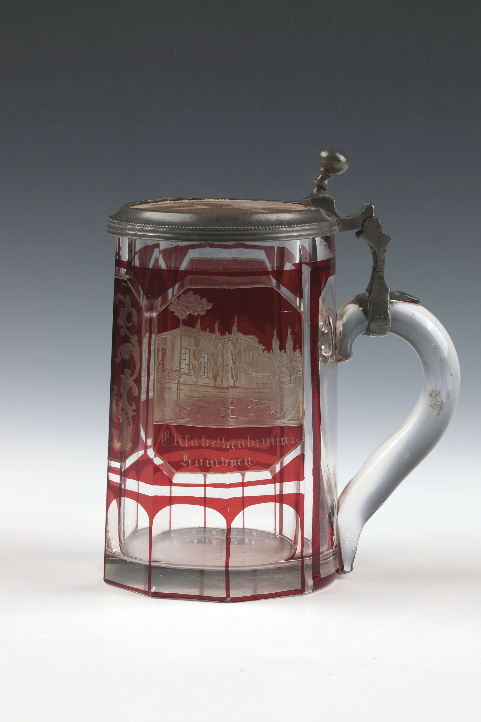 Mug with views of Bad Homburg: Jug with views of Bad Homburg Around 1860 On the wall tapering upwards, peeled, partly ruby-red glazed, two cut views, inscribed ''Kursaal'' and ''Elisabethenbrunn i. Homburg''. Lid with pewter frame,