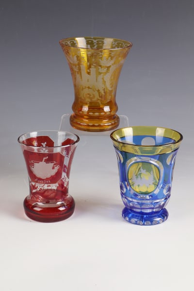 Three Cups: Three cups Bohemia, mid-19th century Colourless glass, partly yellow or red or yellow and blue glazed. Circumferential depictions of animals (ducks, hare and deer in front of a landscape backdrop),