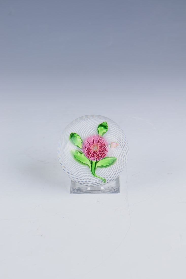 Paperweight with dahlia: Paperweight with Dahlia Clichy, mid-19th century Dahlia branch set over Latticino cushion with pink flower, bud and green stem with three pinched leaves. Slightly hollow-ground bottom. Slight scratch