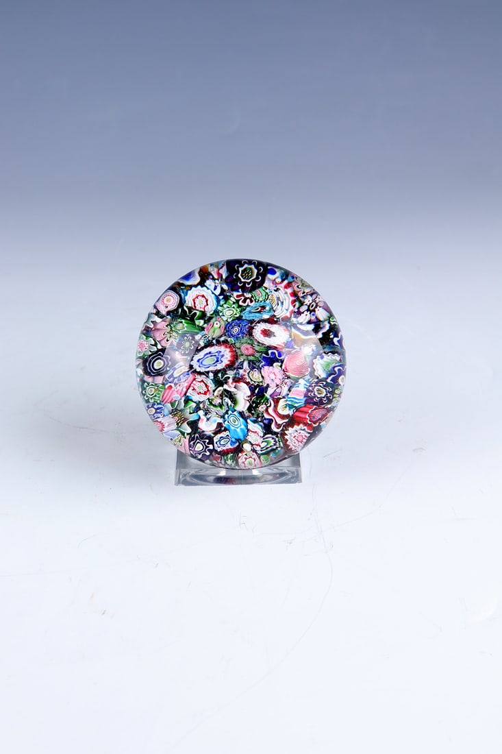 Paperweight: Paperweight Clichy, mid-19th century. Colourless upholstery with various millefiori rods set all over the area. Surface with signs of wear (scratches). D.7.8cm