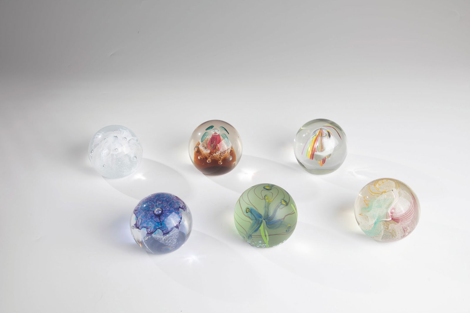 Six paperweights: Six paperweights Caithness, Scotland, 20th century Six paperweights with different decorations. All on the bottom with the signature ''Caithness Scotland'' and the designations ''Iris
