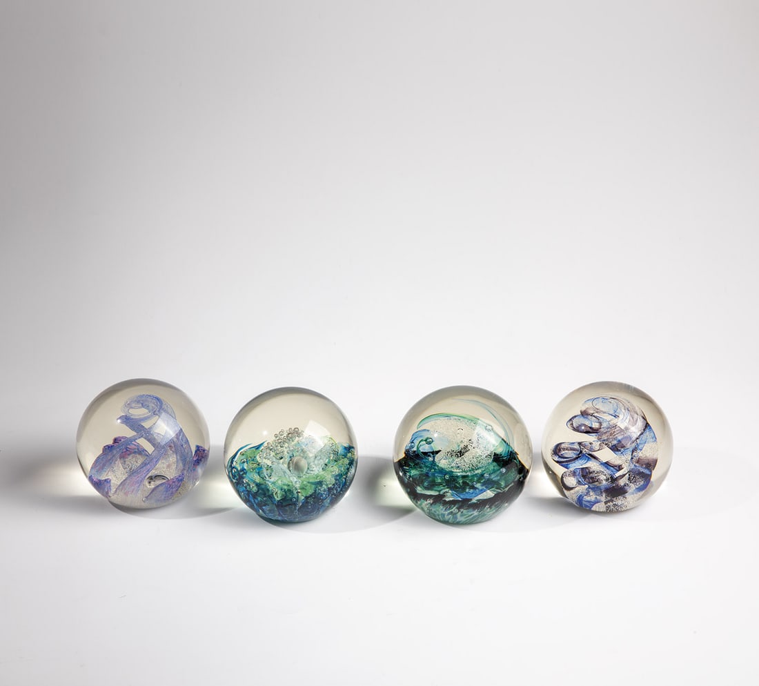 Four paperweights: Four Paperweights Scotland, Selkirk Glass, 20th Century Mixed lot of four paperweights with original label on the bottom as well as signature and designation ''Spring Breeze'','Ribbons'','Spindrift''