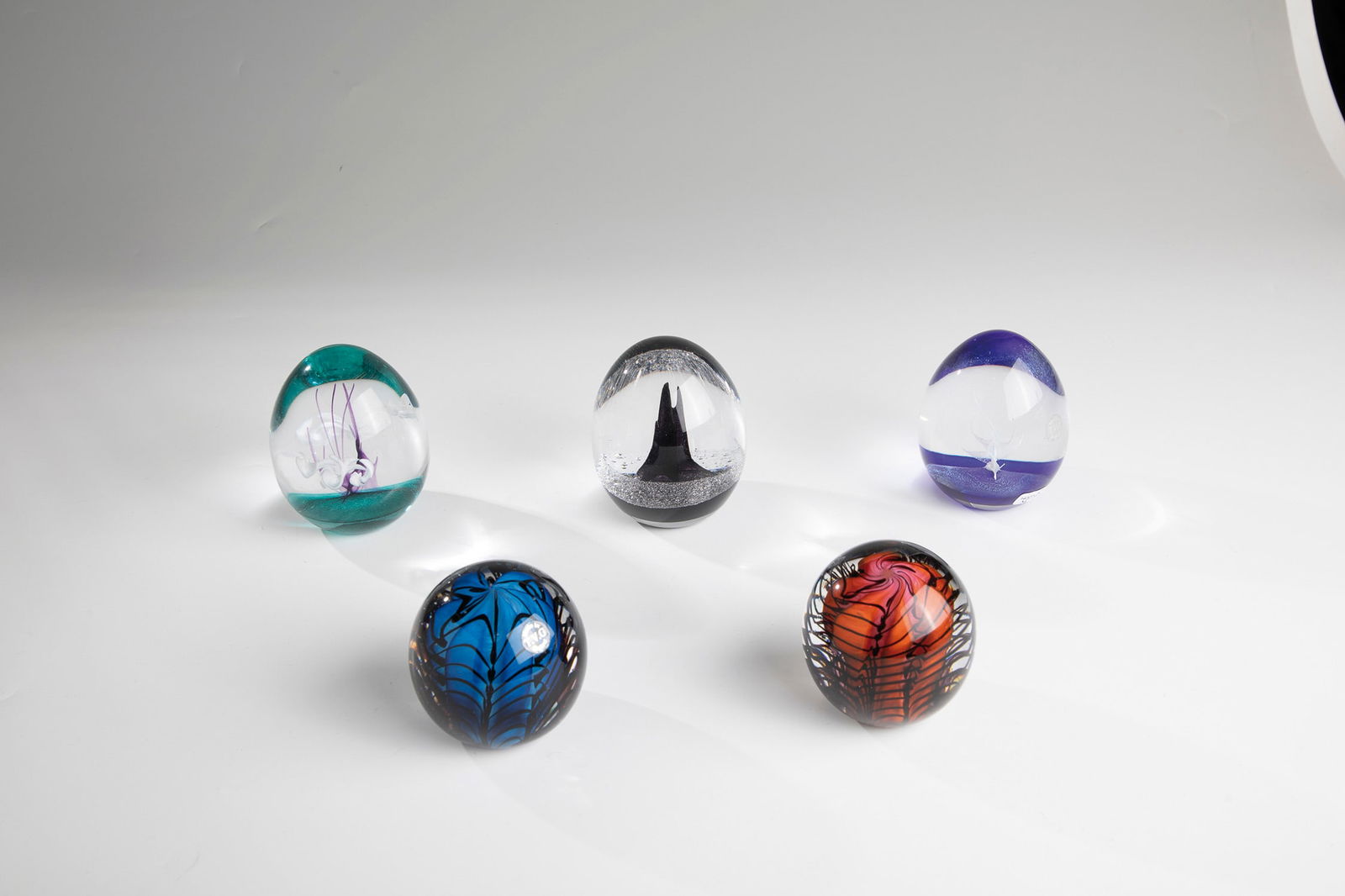 Five Paperweights: Five paperweights Teign Valley Glass, England, 20th century Five paperweights from the Teign Valley Glass manufactory with original labels ''TVG England'' and signature on the bottom, two of them