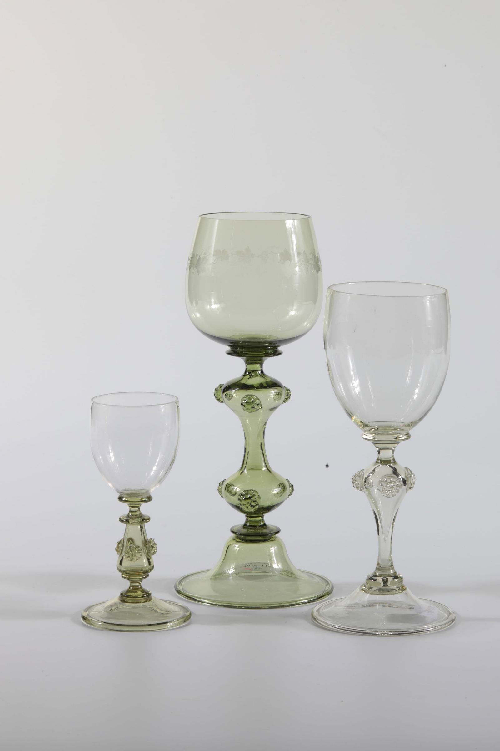 Pair of carafes ''Fugger'' with stoppers: Pair of carafes ''Fugger'' with stopper Rheinische Glashütten AG, Cologne-Ehrenfeld, around 1881 Apple-green glass. Appliqués in the form of nubbles and wound threads, partly ribbed, on carafe and s