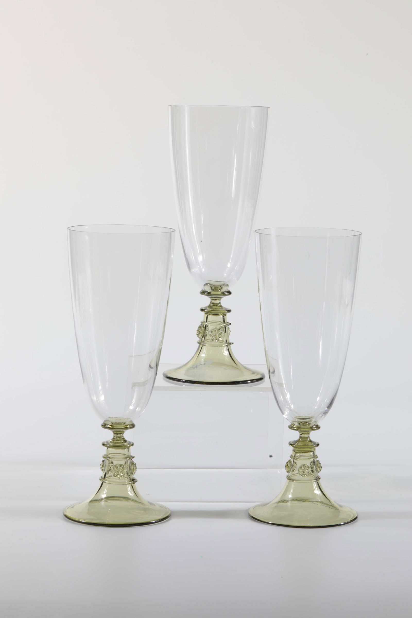 Three Beer Glasses Cranach: Three beer glasses Cranach Rheinische Glashütten AG, Cologne-Ehrenfeld, around 1881 Yellow-green, hollow base and stem. Colourless cuppa, on the stem three nubbes in star shape and threads. H: 19 cm.