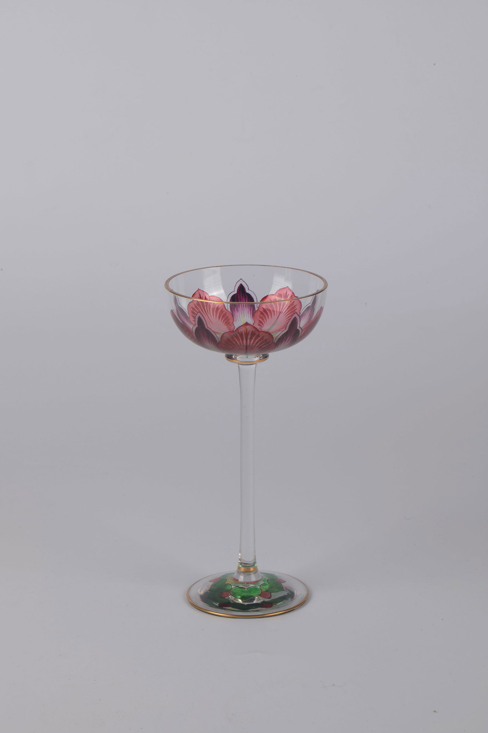 Stem jar: Stemmed glass Bohemia or Bavarian Forest, c. 1900 Colourless glass. On the top of the foot and cuppa, colourful transparent and black solder painting. Circumferential décor: stylized sepals. Disc nod