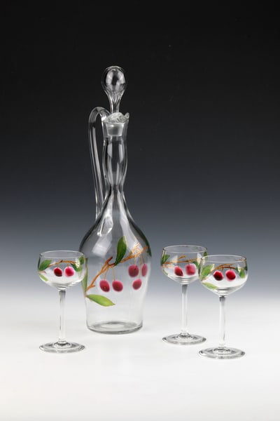Handle carafe with stopper and 3 stem glasses ''Cherry Branch'': Handle carafe with stopper and 3 stem glasses ''Cherry Branch'' L. Moser & Sons, Carlsbad, around 1900 Colourless glass with melted ruby-red dots. Decorated in colorful transparent enamel. Contour