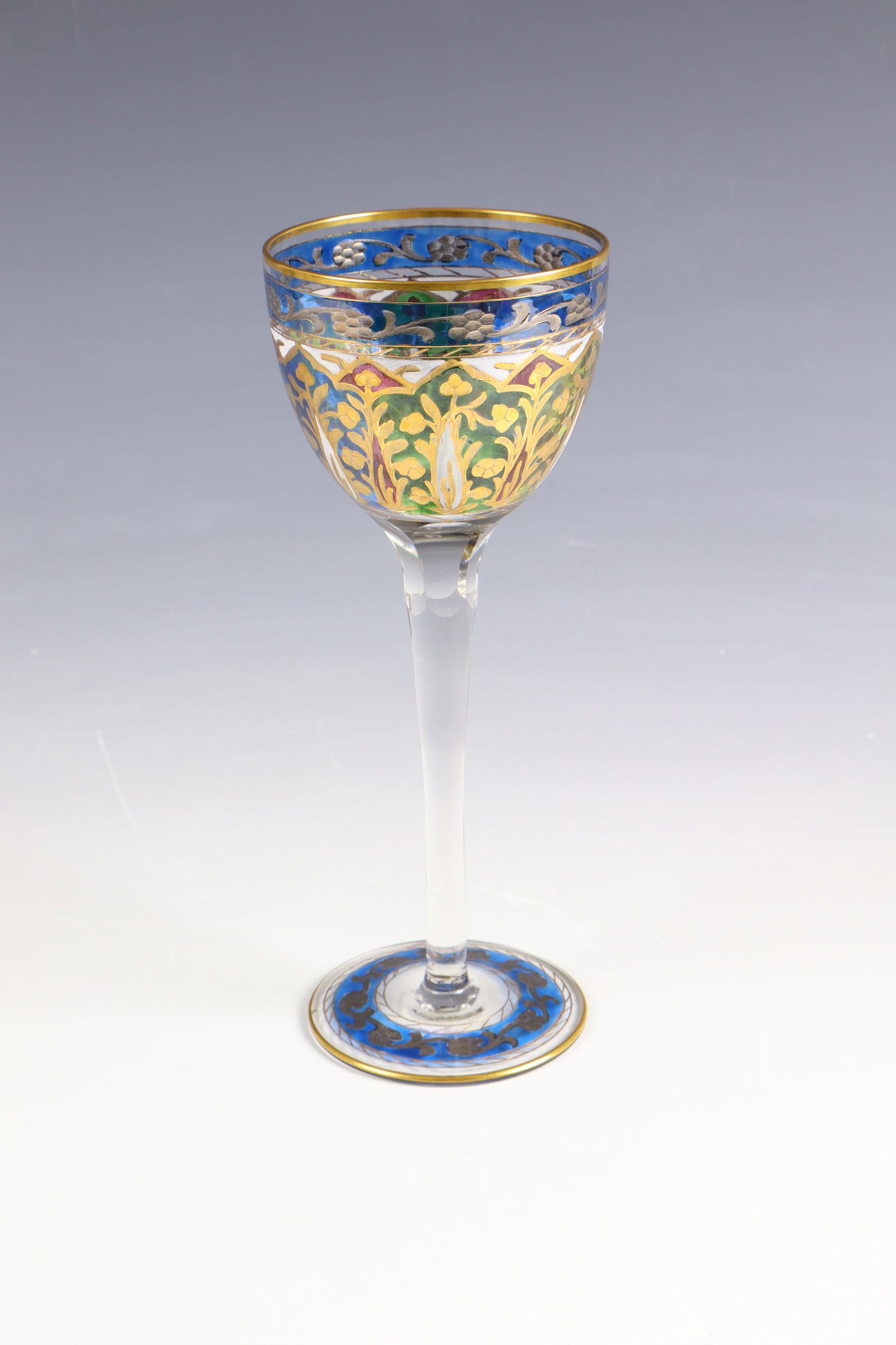 Wine glass ''Jodhpur'': Wine glass ''Jodhpur'' Fritz Heckert, Petersdorf, around 1900 Colourless glass with polychrome, transparent enamel and polished gold painting; ornamentalflooral décor. Kuppa six-faceted at the base.