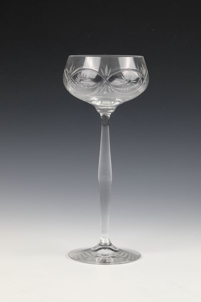 Set of Nine Wine Glasses: Set of nine wine glasses from the Theresienthal crystal glass manufactory, c. 1900 Colourless glass with repeating cut decoration all around. H. 20.5 cm each. Decor 1891 - Form 1496