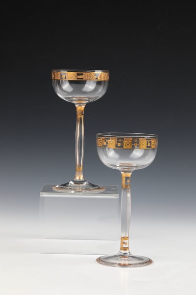 Pair of stem jars: air of stem glasses Georg Carl v. Reichenbach (design), Benedikt v. Poschinger, Oberzwieselau, c. 1906 Colourless, partially cut glass with etched and gilded geometric decoration. H. 16 cm Lit.: Chr.