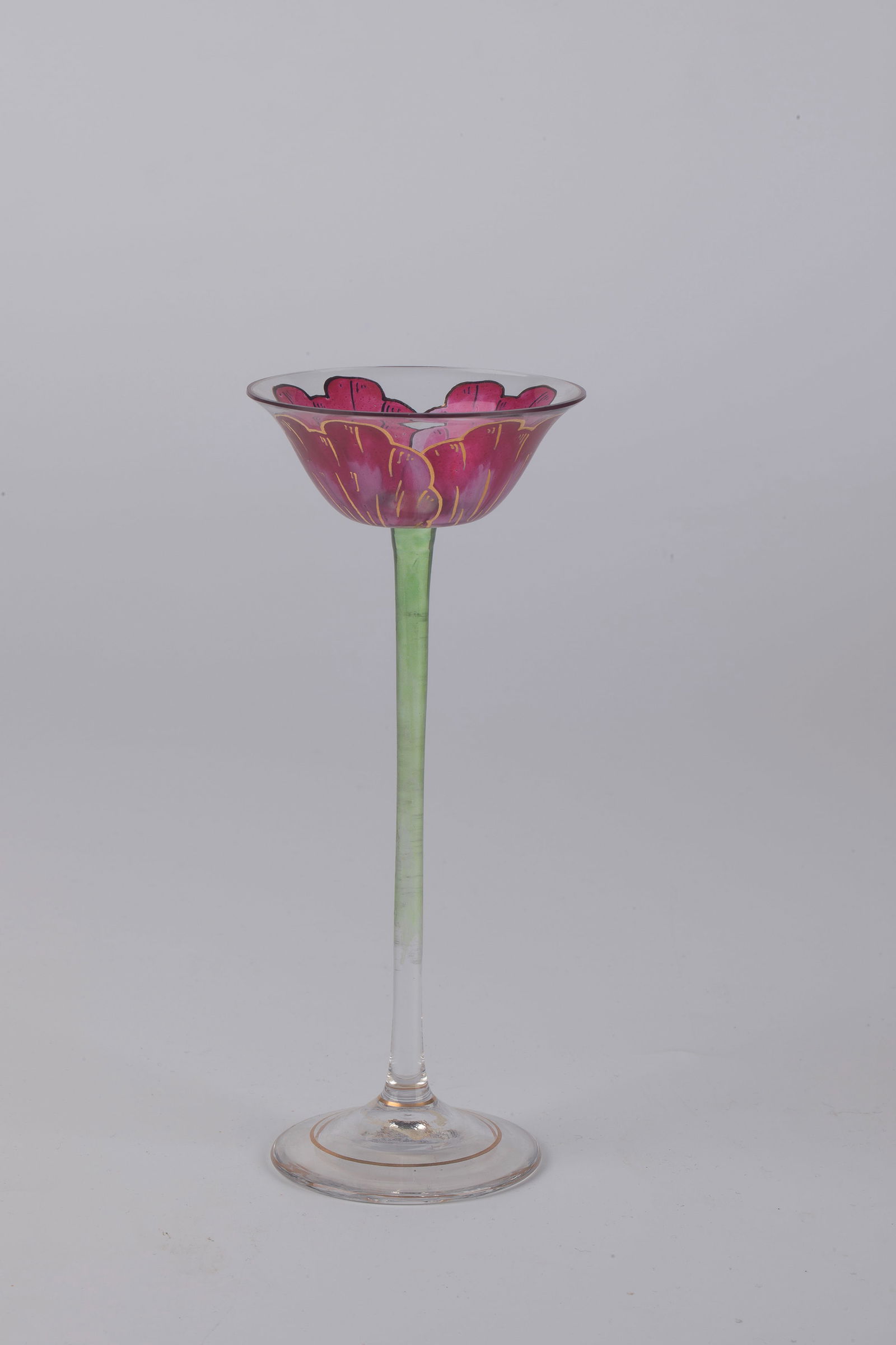 Stem jar: Stem glass German, around 1900 Colourless glass. Slender stem with green transparent enamel. The bowl-shaped cuppa with gold-heightened and contoured, red transparent enamel painting. Decor: Stylized