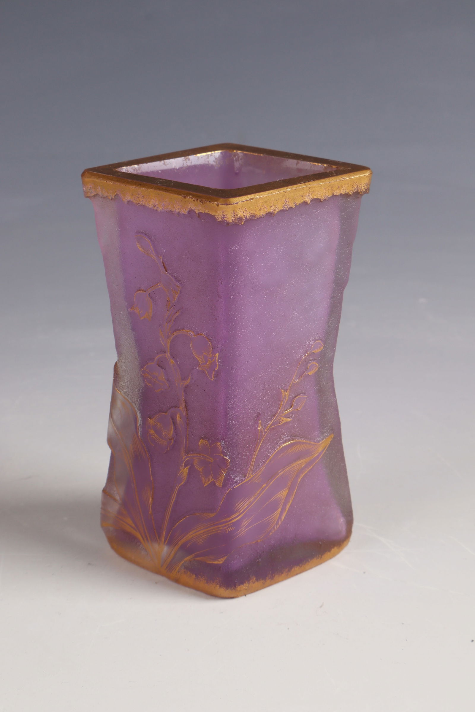 Vase with lily of the valley ''Muguets'': Vase with lily of the valley ''Muguets'' Daum Frères, Nancy, c. 1896 Colourless glass, violet underlay. Relief etched décor, cut and gold painted. Inscription: Daum Nancy with Lorraine Cross (painte