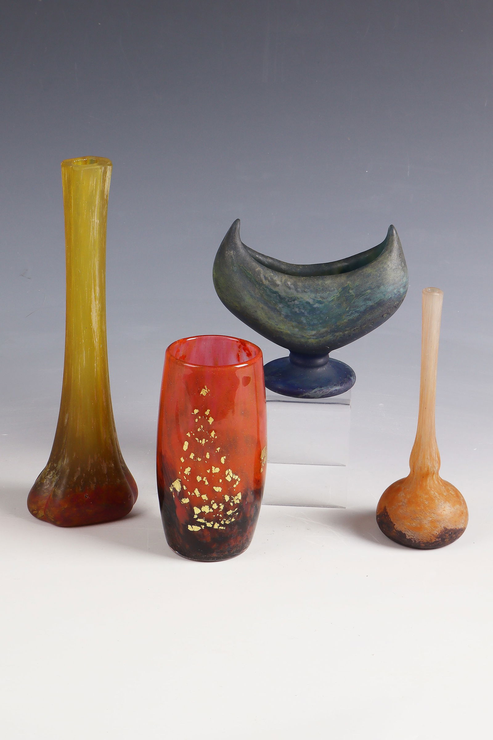 Foot bowl and 3 vases: Foot bowl and 3 vases Daum Frères, Nancy, 1910 - 1920 Colourless glass with multicoloured powder, partly with metal foil inclusions. Surface partially matte. All parts inscribed: DAUM NANCY with Lorr