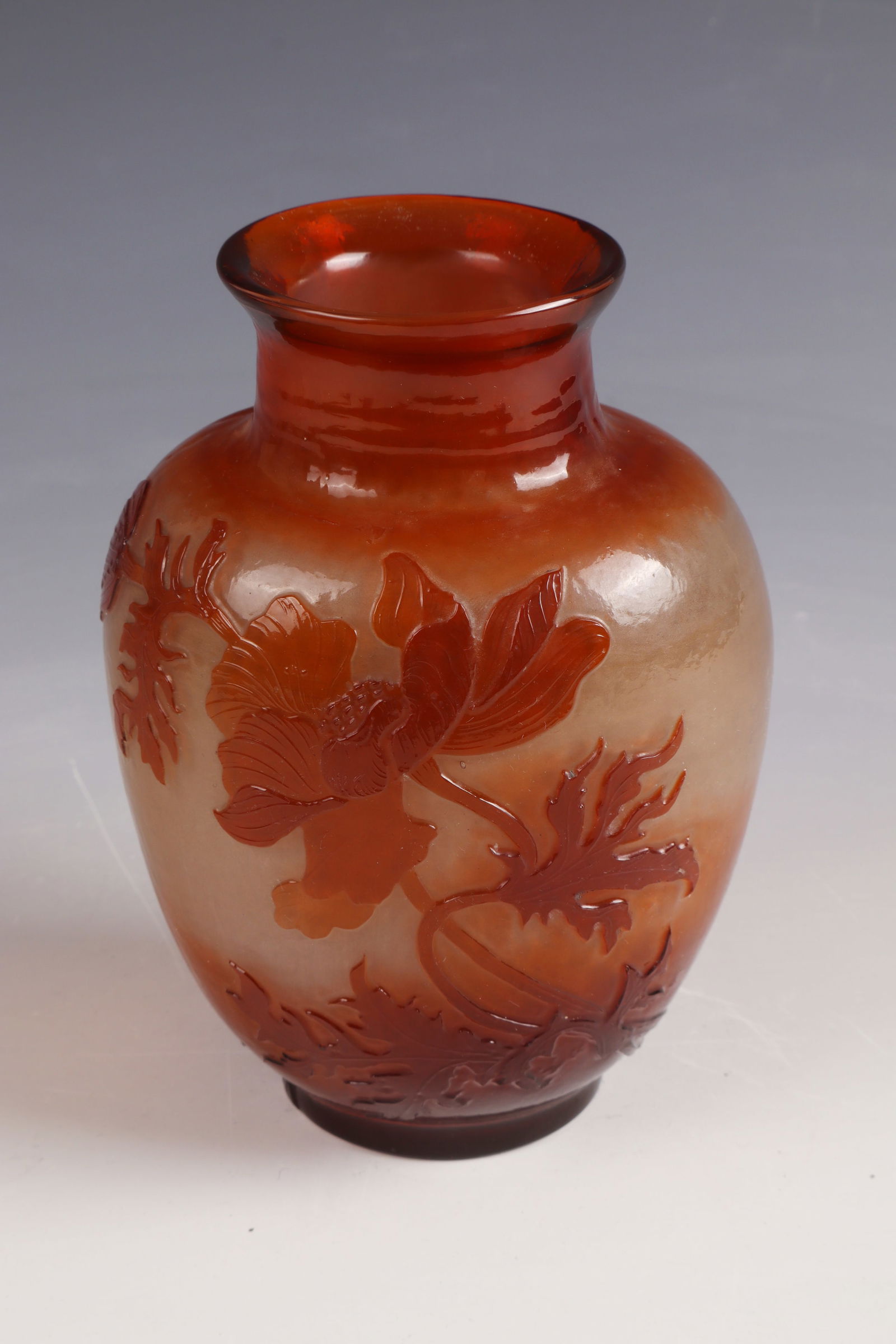 Vase with poppy seeds ''Pavots'': Vase with poppy seeds ''Pavots'' Emile Gallé, Nancy, c. 1900 Colourless, frosted glass on the inside, overlaid orange-brown. Relief etched décor. Interior drawing in flat high etching. Surface acid-