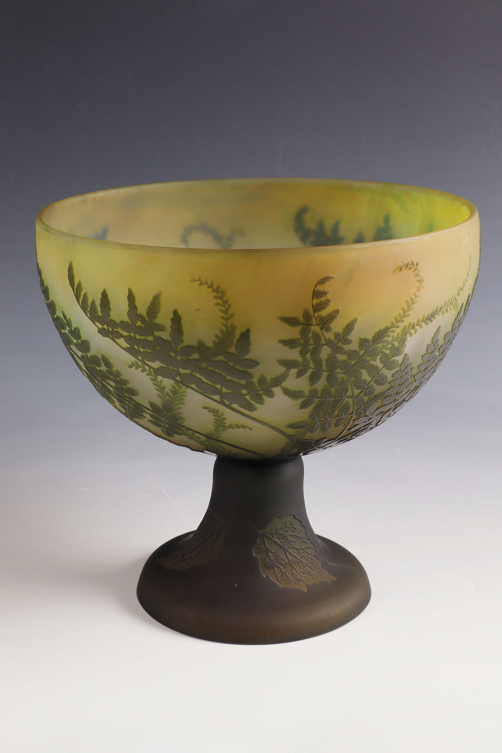 Large foot bowl with fern ''Fougères'': Large foot bowl with fern ''Fougères'' Emile Gallé, Nancy, 1900 - 1904 Colourless, frosted glass, green overlay. High or low etched décor. Interior drawing in high etching. Reference: Gallé