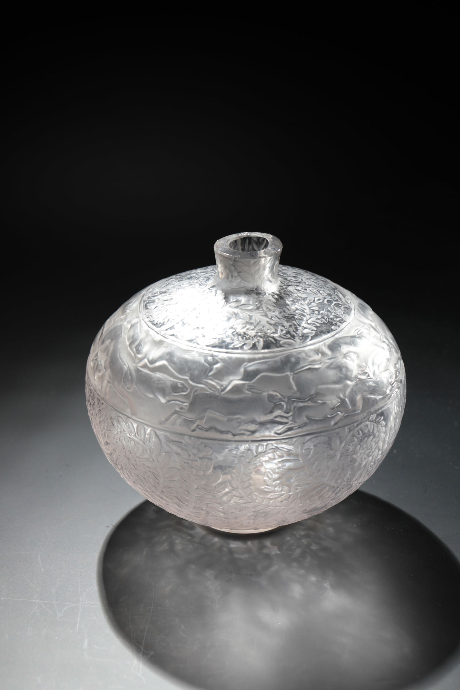 Vase ''Lièvres'': Vase ''Lièvres'' R. Lalique, Wingen - sur - Moden, 1923 Colourless glass, moulded, refinished by polish. Underside labeled: Lalique (diamond-scratched). Neck sharpened. H. 13 cm Lit.: Marcilhac, Cata