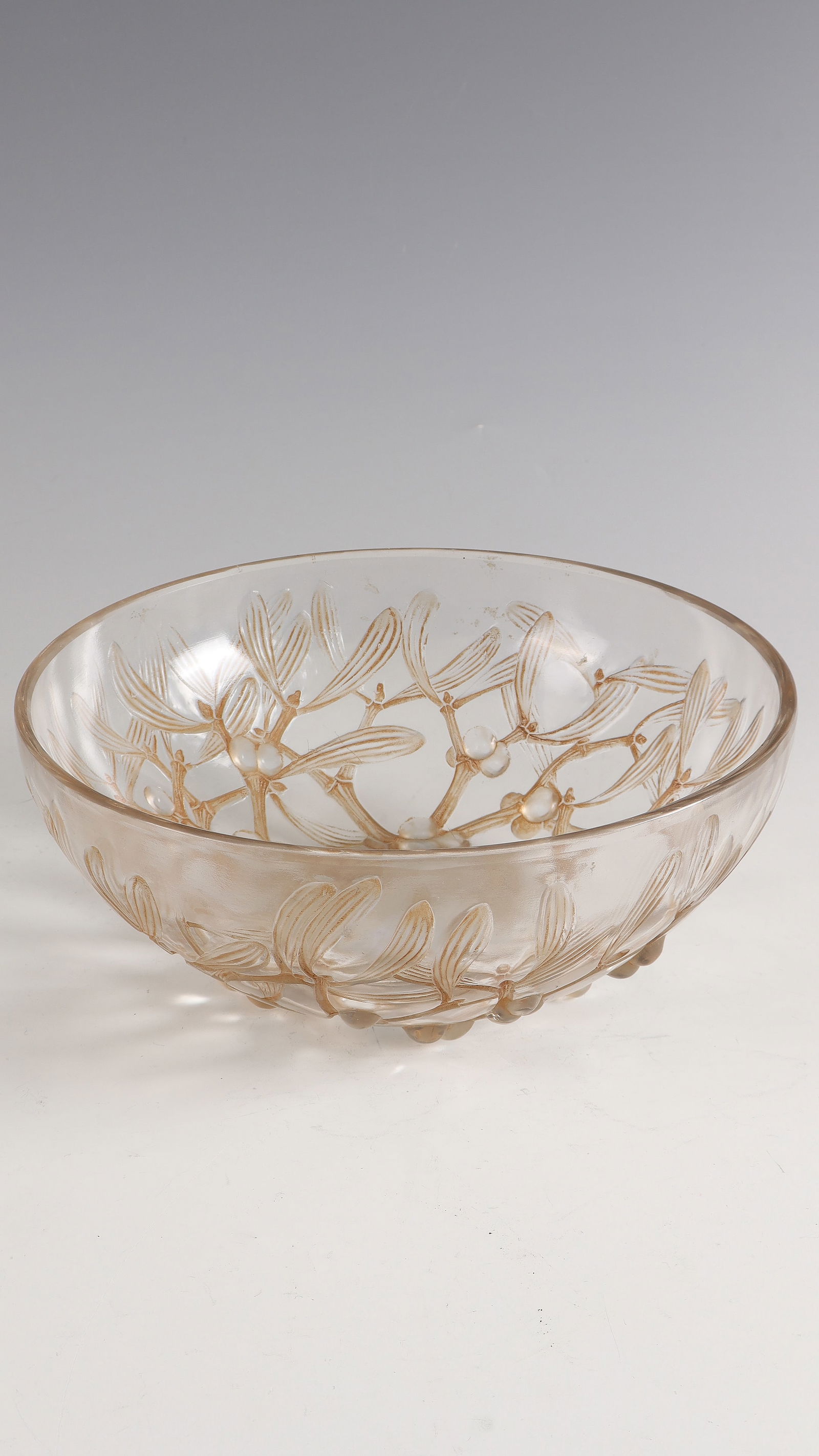 Bowl ''Gui N° 1'': Bowl ''Gui N° 1'' René Lalique, Wingen - sur - Moder, 1921 Colourless glass, moulded, brown patina, refinished by polish. Ref: R. LALIQUE (compression molded). h. 9.5 cm; d. 24 cm Lit.: G. Cappa,