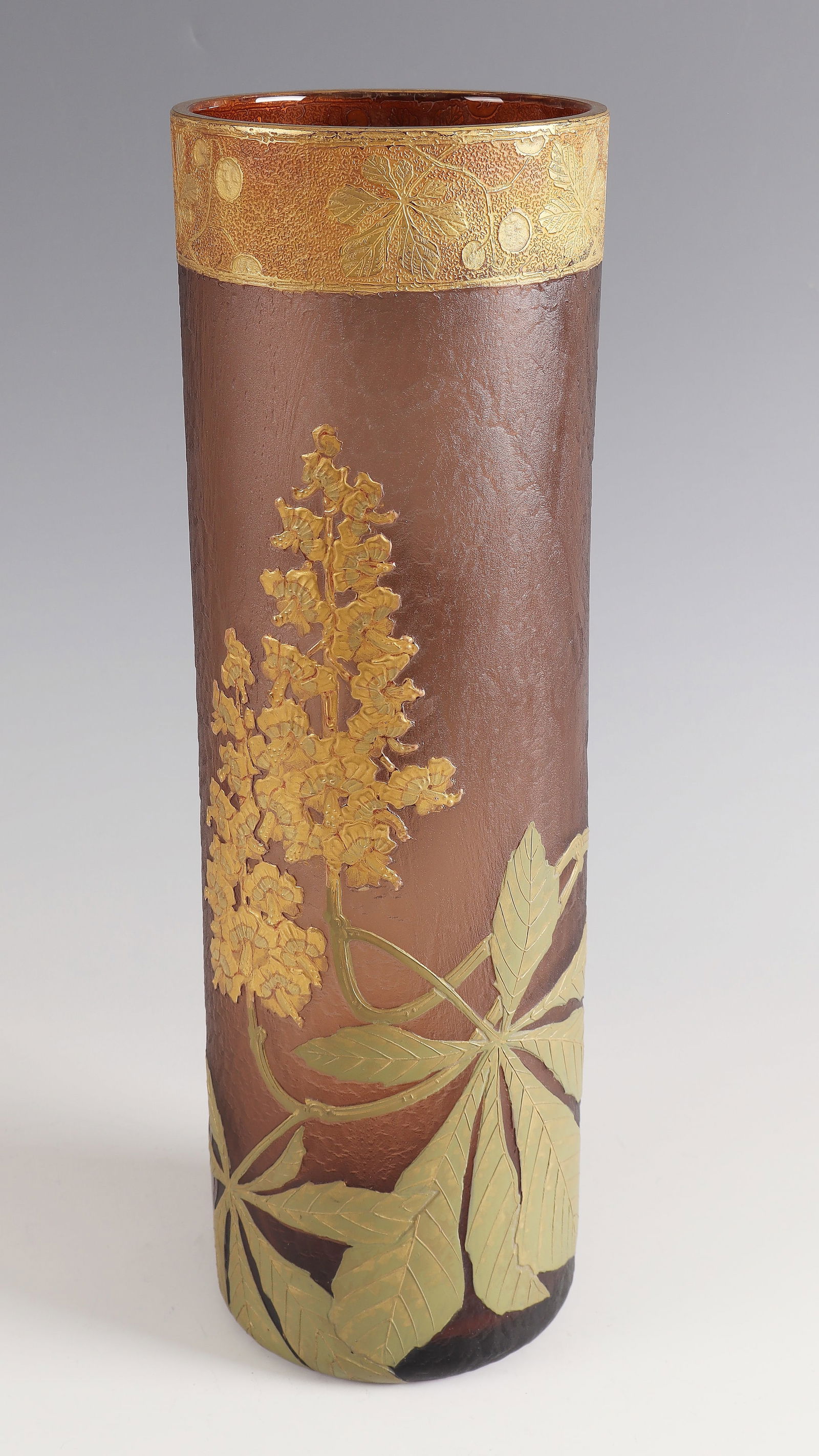 Cylinder vase with chestnut ''Marronier'': Cylinder vase with chestnut tree ''Marronier'' Legras, Verreries de Saint - Denis, around 1900, brown-pink glass. Relief-etched, enameled and gilded décor. H. 39.5 cm Lit.: G. Cappa, Le Genié