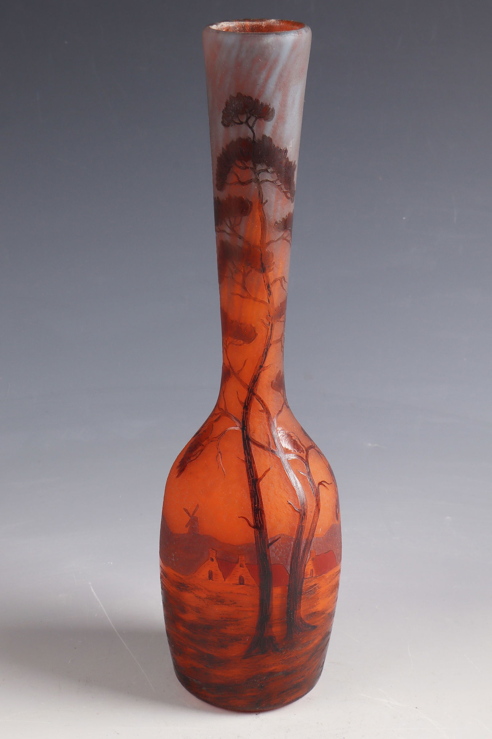 Long-neck vase ''Paysage aux toits rouges'': Long-neck vase ''Paysage aux toits rouges'' Muller Frères, Lunéville, 1910 - 1914 Colourless glass with multi-coloured powder melting. Relief etched and colorful enameled décor. Inscription: