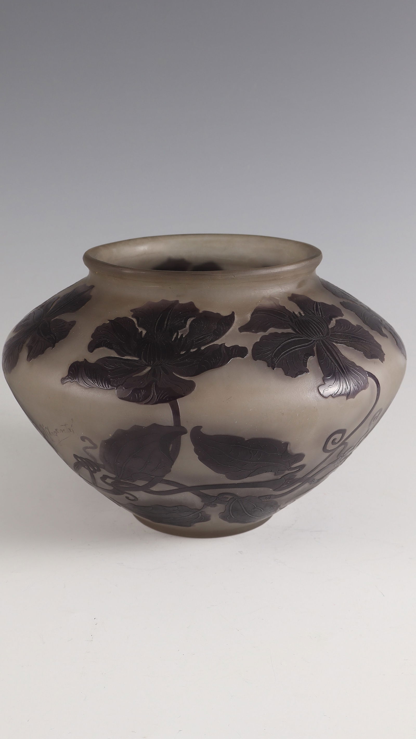 Vase with clematis: Vase with Clematis Paul Nicolas, 1919 - 1925 Colourless glass, violet overlay. Relief etched décor. Flat-etched interior drawing. On the wall inscribed: d'Argental with Lorraine Cross (etched up).