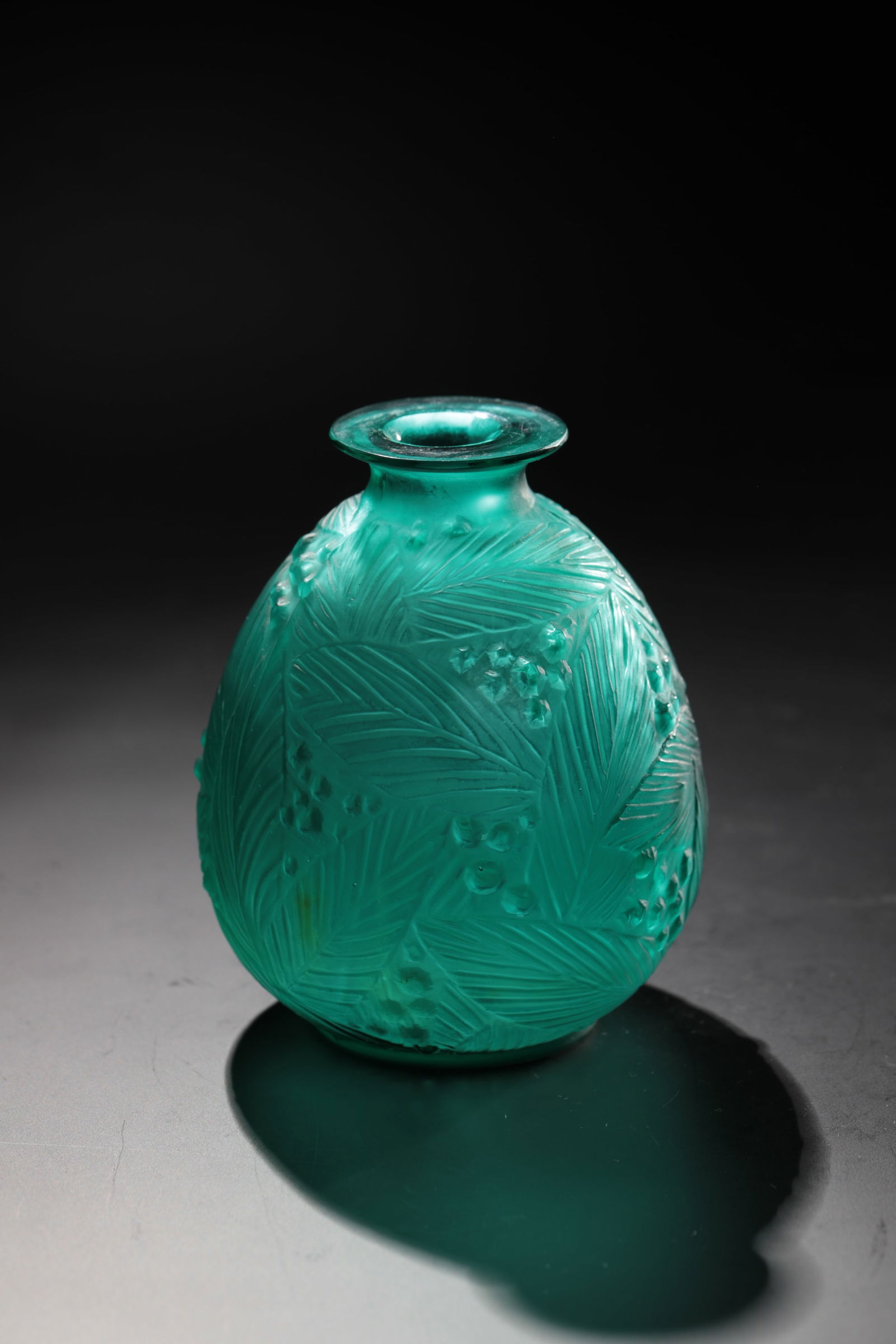 Vase ''Borneo'': Vase ''Borneo'' René Lalique, Wingen - sur - Moder, 1930 Colourless glass, moulded, finished by cutting and polishing. Underside inscribed: R. LALIQUE (sandblasted). H. 24 cm. Lit.: G. Cappa, Le Geni