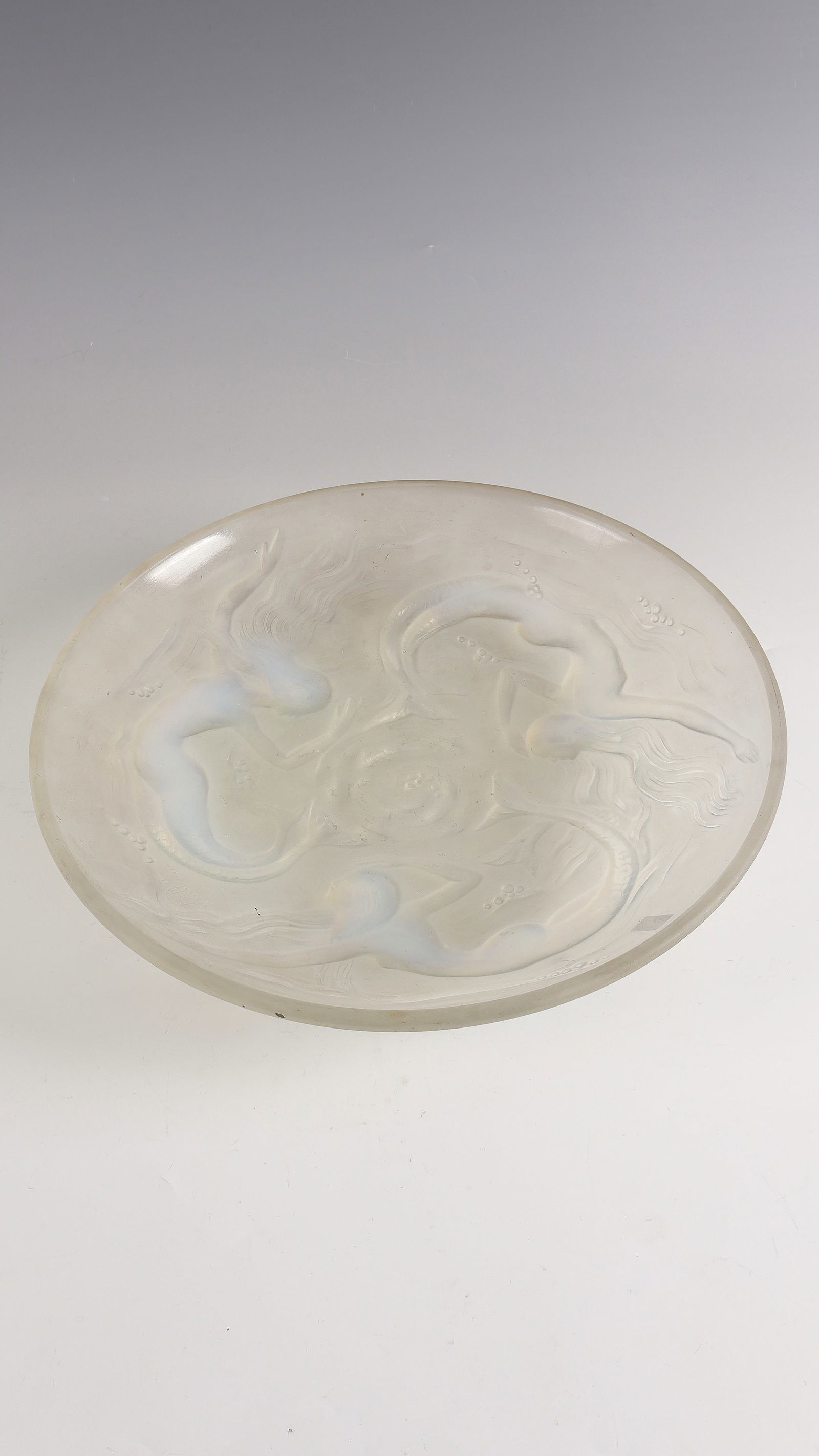Bowl with mermaids ''Ondines'': Bowl with mermaids ''Ondines'' Marius Sabino, 1930 - 1935 Colourless, partially opalescent glass, moulded, finished with polish. Reference: VERART (compression molded). D. 35.5 cm Lit.: G. Cappa, Le