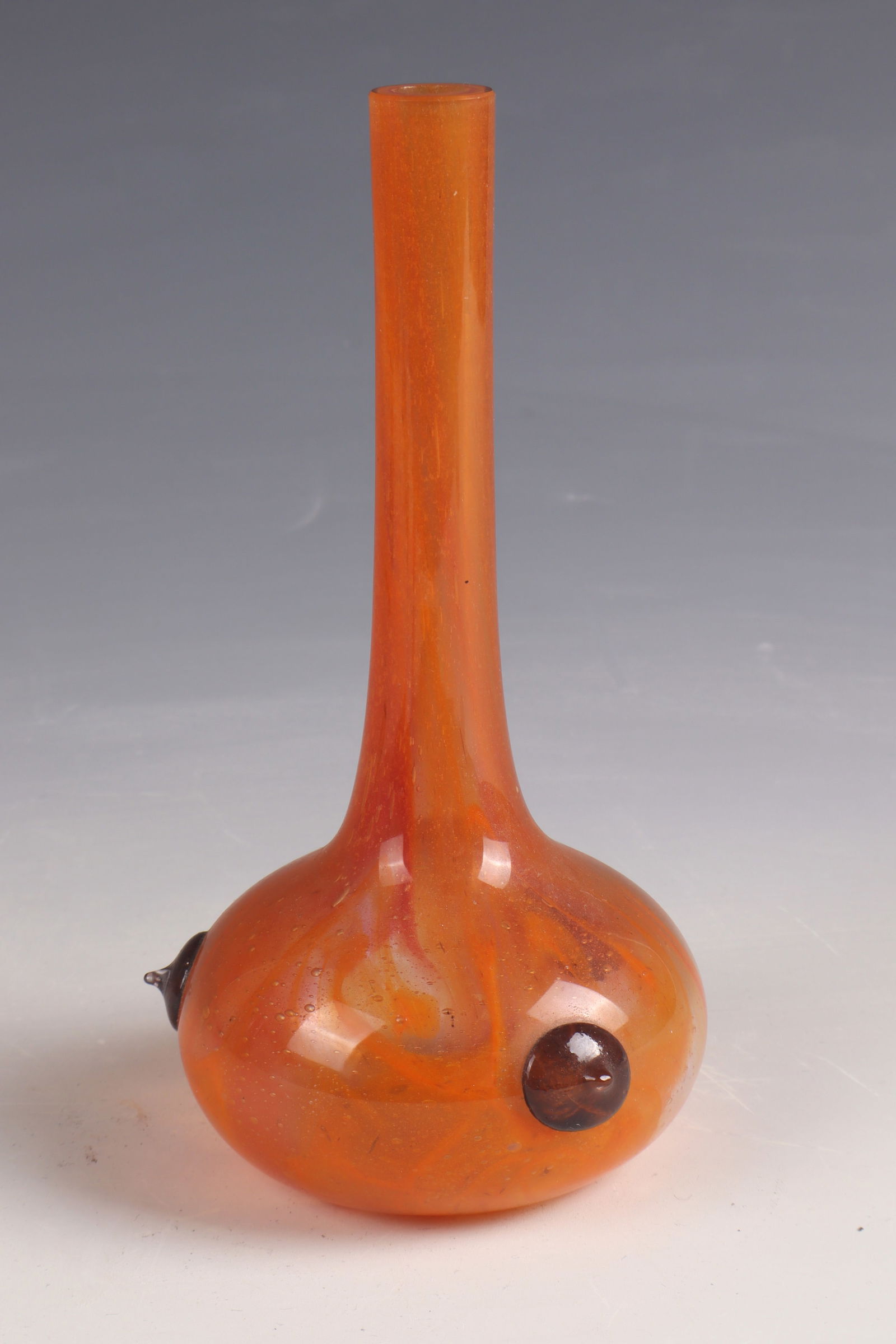 Small long-neck vase ''Bijou'': Small long-necked vase ''Bijou'' Charles Schneider, Epinay - sur - Seine, 1920 - 1924 Colourless glass with orange-yellow powder melting. Three cabochons in colorless with dark purple powder melting.