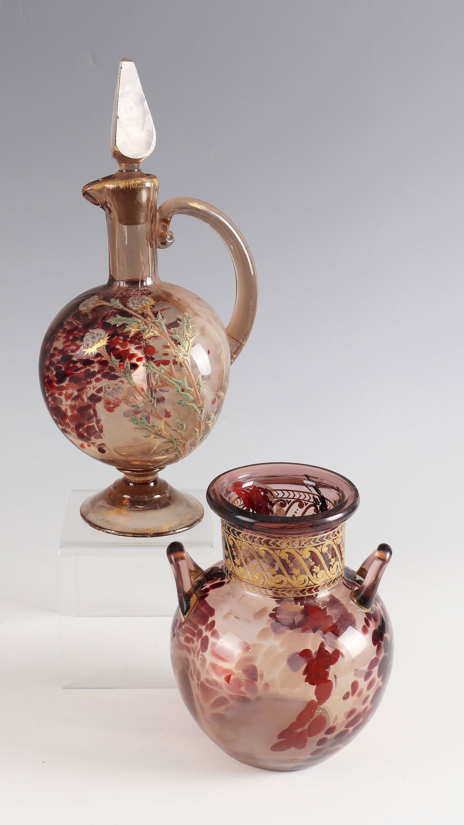 Carafe with stopper and handle vase: Carafe with stopper and handle vase Cristallerie de Sèvres, 1885 - 1890 Smoky brown glass with multicolored crumb melting. Decor: Thistles and ornaments in gold and coloured opaque enamel painting.