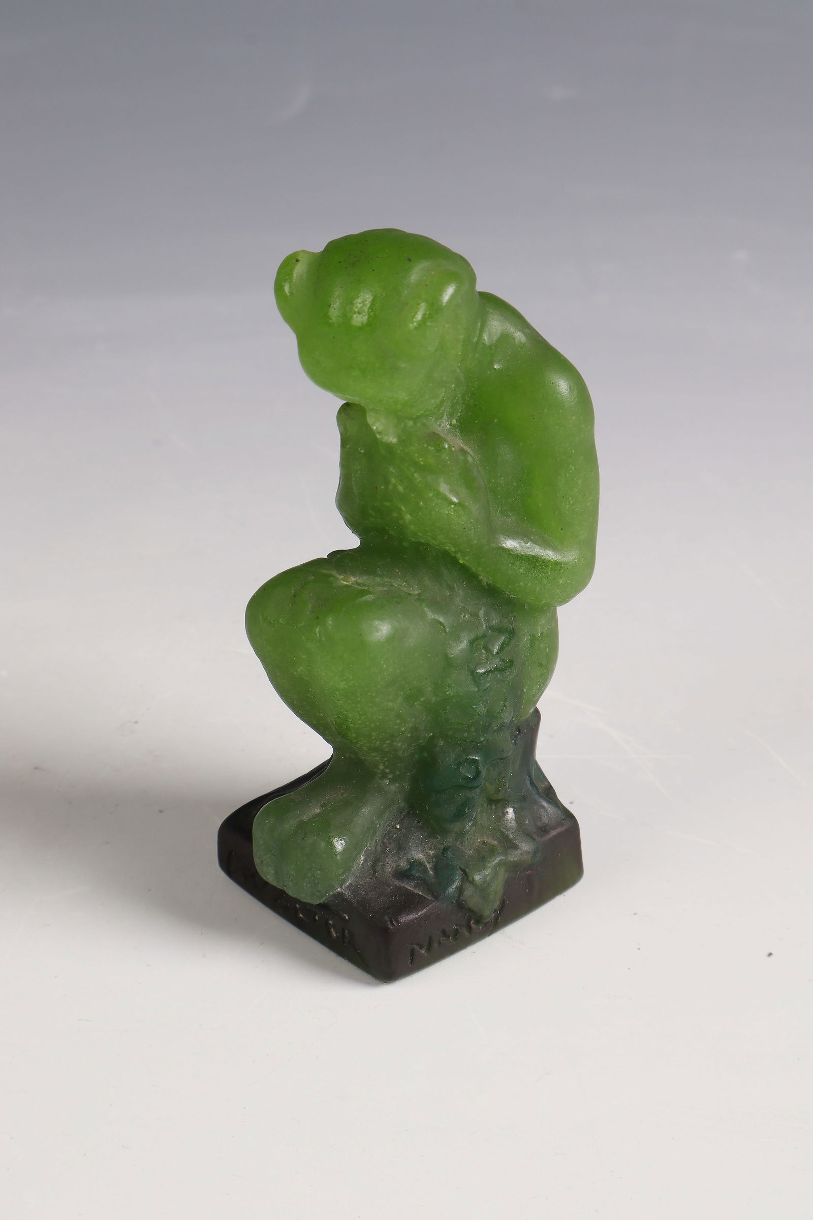 Seated Faun with Pan Flute: Seated Faun with Pan Flute Amalric Walter, 1921 - 1925 - Design: Henri Bergé Pâte de verre in green, compressed. Ref.: AWalter Nancy HB (compression molded). H. 9 cm Lit.: G. Cappa, Le Génie