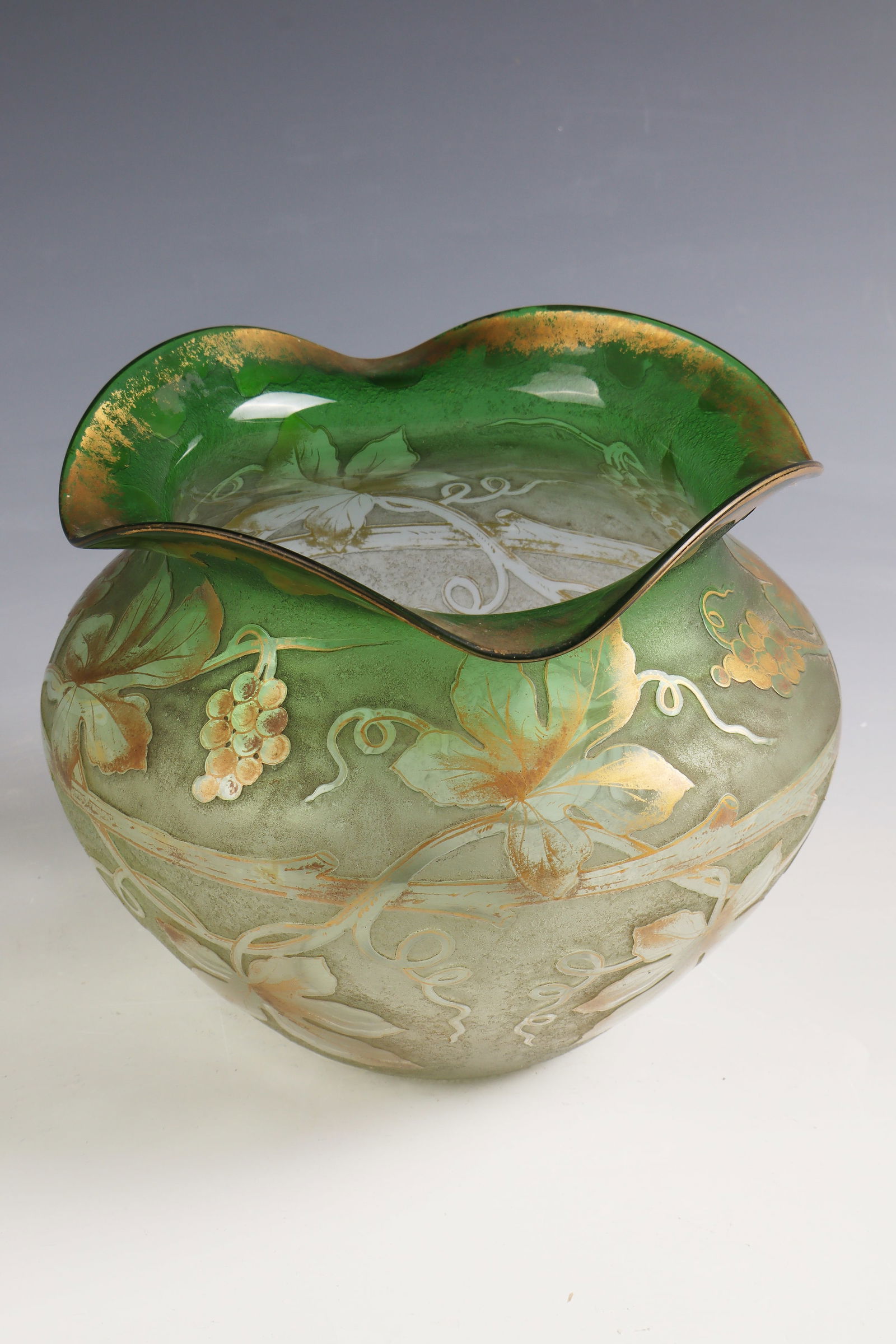 Vase with vine ''Cep de vigne et raisins'': Vase with vine ''Cep de vigne et raisins'' Gräflich Harrach'sche Glasfabrik (shrouded), New World, 1898 - 1900 Colourless glass, running green underlay. Relief etched décor. Contour and interior