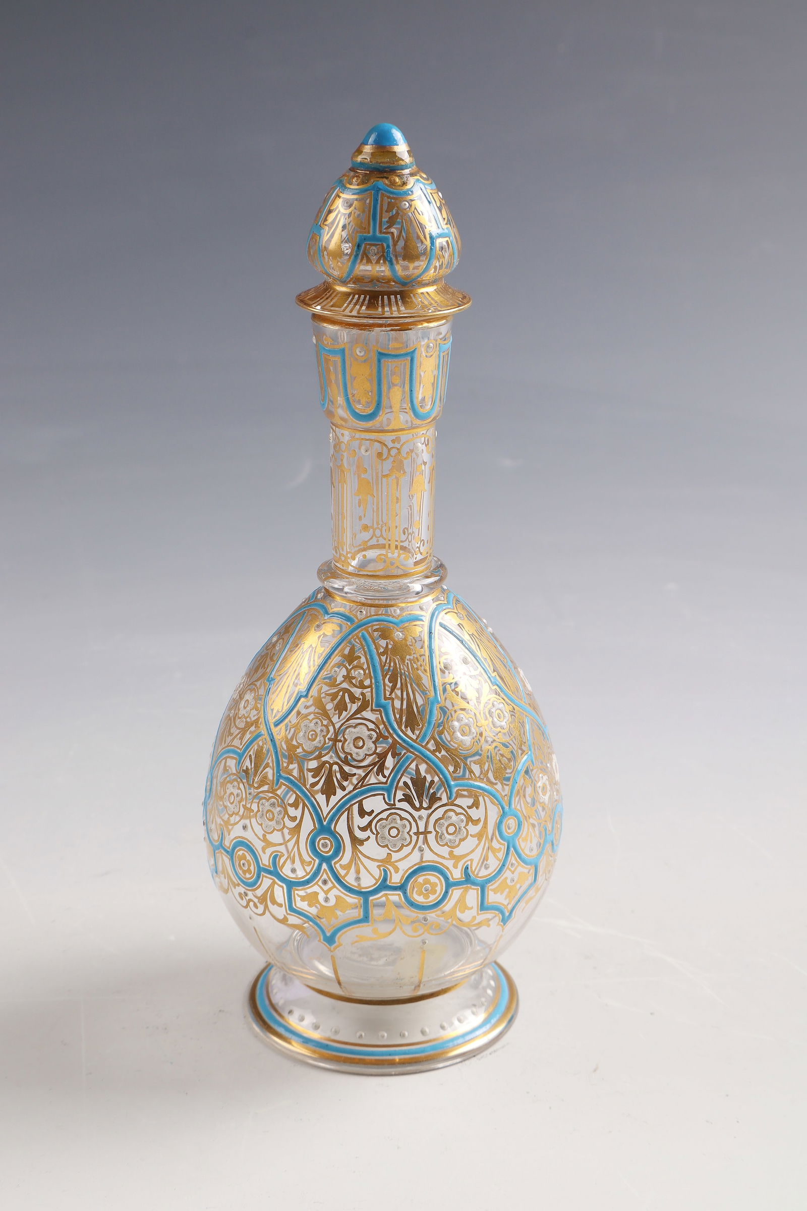 Bottle with stopper: Bottle with stopper J. & L. Lobmeyr, Vienna, 1878 Colourless glass with orientalising decoration in polished gold, white and light blue opaque enamel. Ref.: Ligature monogram (painted in opaque white