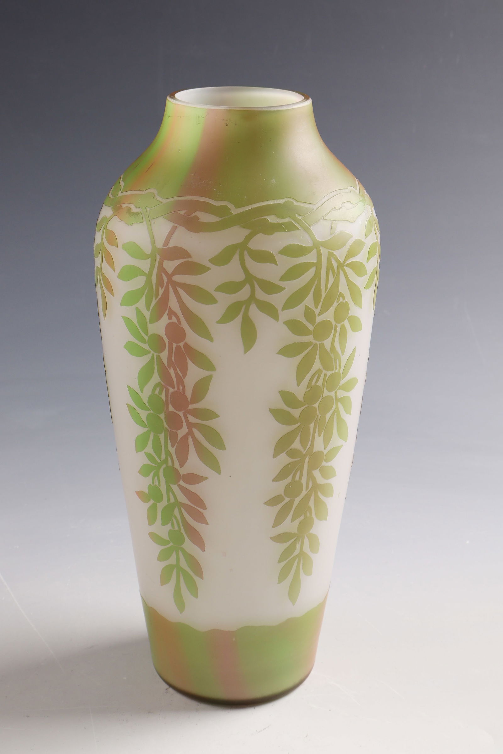 Vase with berry branch: Vase with berry branch Beckmann & Weis, Mügeln near Dresden, c. 1910 - 1920 Colourless glass, milky white underlay inside. Green-ruby pink marbled overlay layer. Relief etched décor. On the lower wa